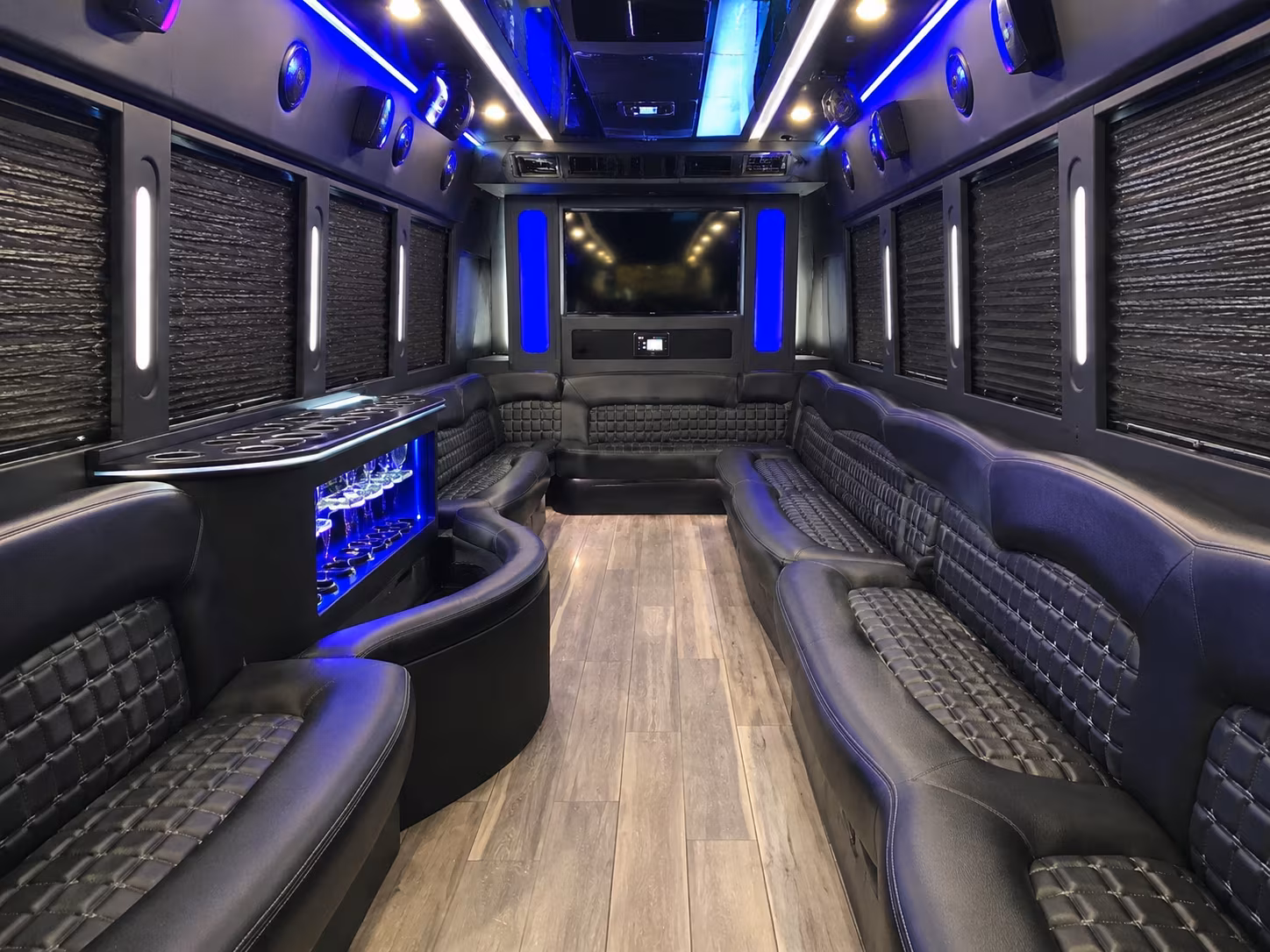 Group beside a Mercedes Sprinter limo in Santa Ana